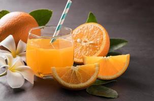 Orange and orange juice and sliced orange photo