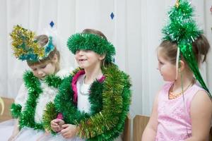 Funny girls in Christmas costumes at the holiday. photo