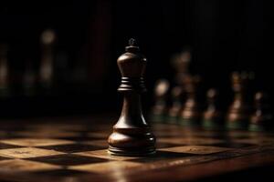 Chess pieces on chessboard, dark background. photo