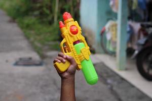 photo of toy gun being carried