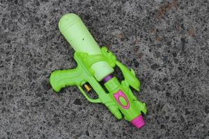 Photo of the green toy gun on the ground