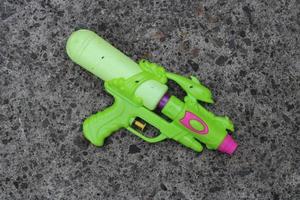 Photo of the green toy gun on the ground