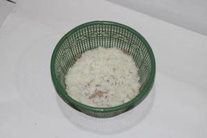 photo of white rice in a green container