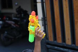 photo of toy gun being carried