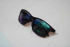 Photo of modern sunglasses with white background