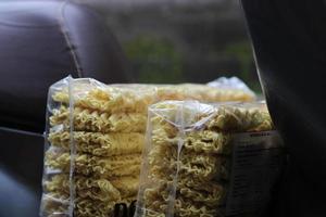 photo of packaged yellow dry noodles