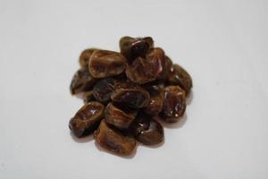 photo of brown dates with a white background