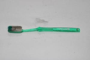 photo of a light green toothbrush