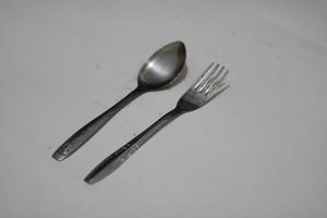 Photo of a silver spoon on a white background