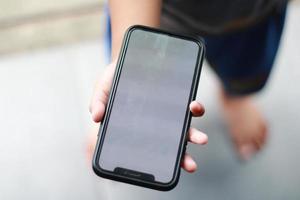 Photo of an empty cell phone held in hand