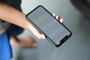 Photo of an empty cell phone held in hand