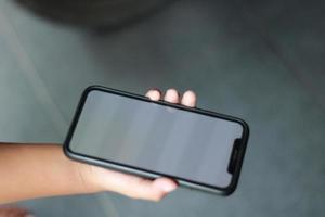 Photo of an empty cell phone held in hand