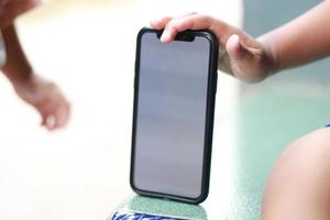 Photo of an empty cell phone held in hand