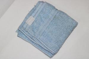 Photo of a light blue towel on a white background