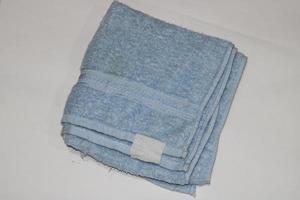 Photo of a light blue towel on a white background