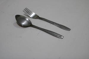 Photo of a silver spoon on a white background