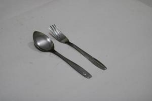 Photo of a silver spoon on a white background