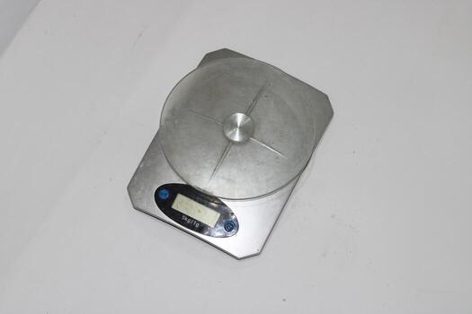 Photo of a digital scale with a white background