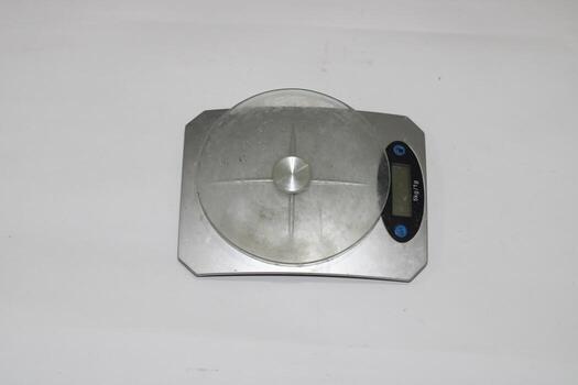 Photo of a digital scale with a white background