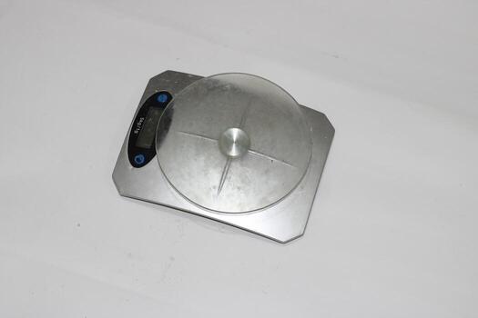 Photo of a digital scale with a white background