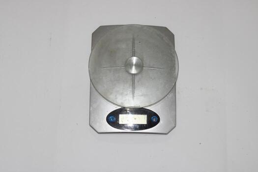 Photo of a digital scale with a white background