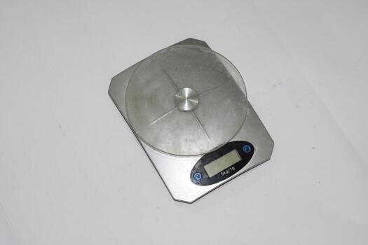 Photo of a digital scale with a white background