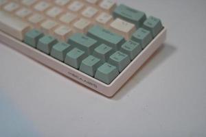 photo of a white and light blue computer keyboard