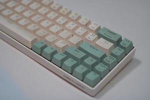 photo of a white and light blue computer keyboard