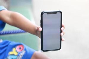 Photo of an empty cell phone held in hand