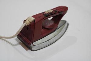 photo of an old silver red iron