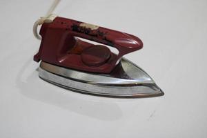 photo of an old silver red iron