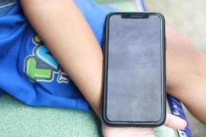 Photo of an empty cell phone held in hand
