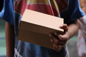 empty brown cardboard photo held in hand