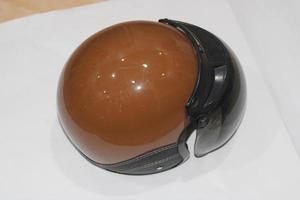 photo of brown helmet with black mirrors