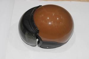 photo of brown helmet with black mirrors