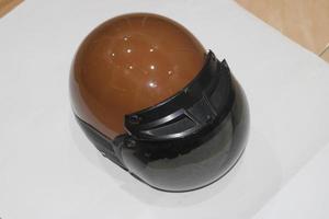 photo of brown helmet with black mirrors
