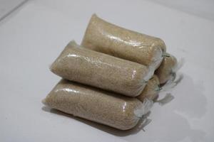 photo of white granulated sugar in plastic wrap