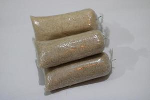 photo of white granulated sugar in plastic wrap