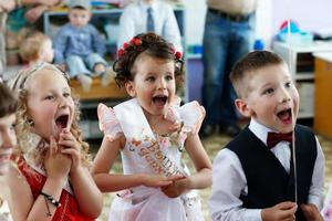 Happy children enjoy a fun party. photo