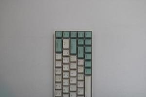 photo of a white and light blue computer keyboard