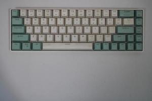 photo of a white and light blue computer keyboard