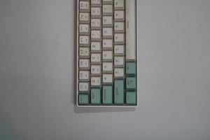 photo of a white and light blue computer keyboard