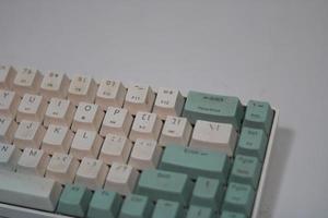 photo of a white and light blue computer keyboard