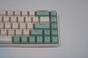 photo of a white and light blue computer keyboard