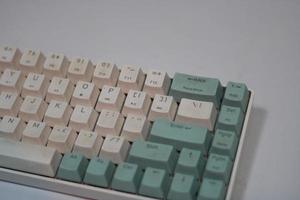 photo of a white and light blue computer keyboard