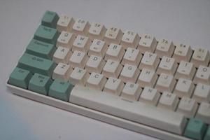 photo of a white and light blue computer keyboard