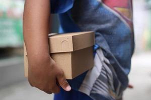 empty brown cardboard photo held in hand