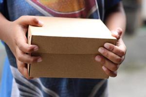 empty brown cardboard photo held in hand