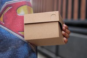 empty brown cardboard photo held in hand