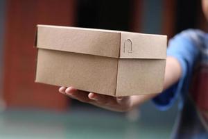 empty brown cardboard photo held in hand